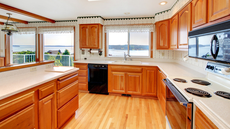 kitchen with outdated honey oak cabinets