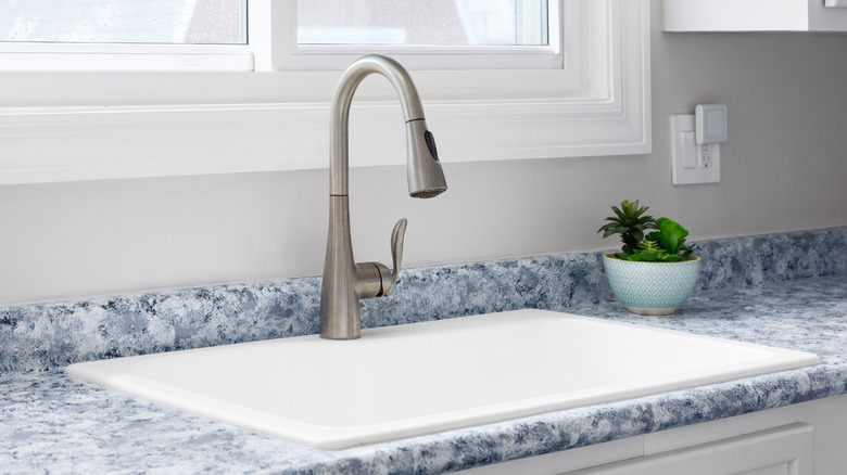 Kitchen sink with vinyl wrapped countertop