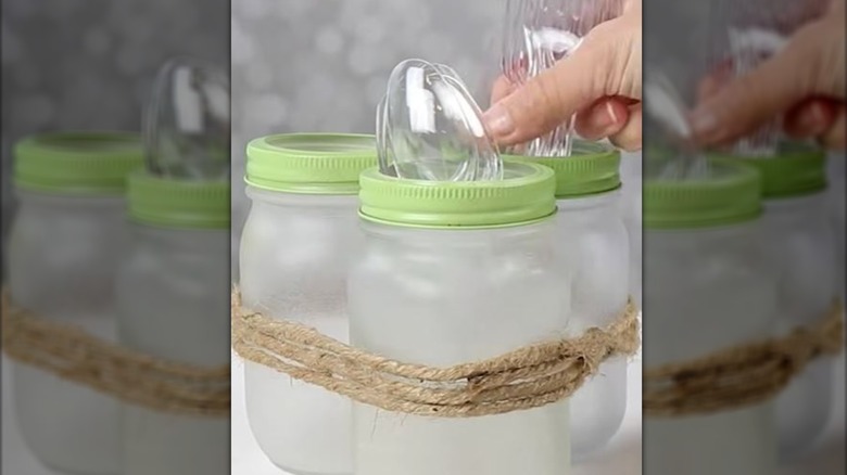 Mason jars turned into cutlery caddy.