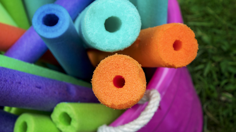 Colorful pool noodles outside