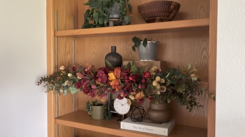 bookshelf with DIY flower decor
