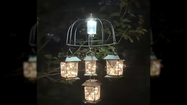 DIY solar lantern chandelier lit up at night