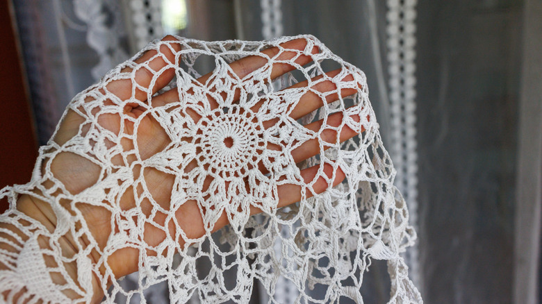 Person holding a doily