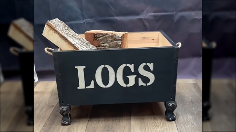 Wooden box holding logs