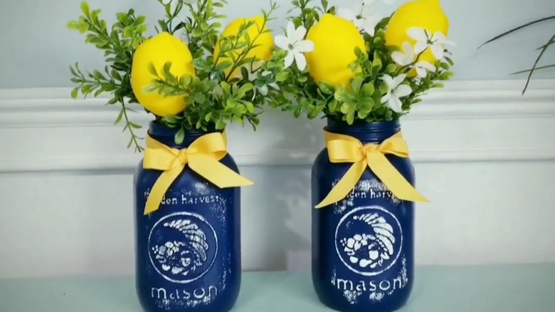 Faux lemons and greenery in painted blue mason jar