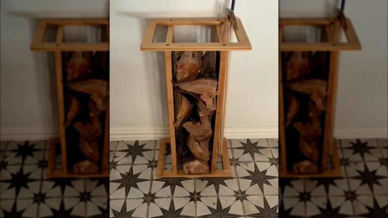 shoe rack flipped on its side and used for firewood and fire poker storage