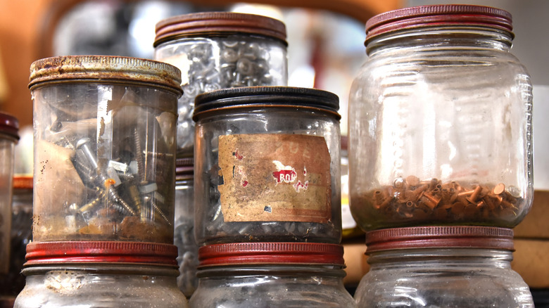 Glass jars with rusty lids and rings