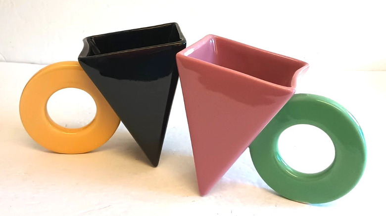 A pair of '80s coffee mugs designed by Peter Shire for the Feltman-Langer Company.