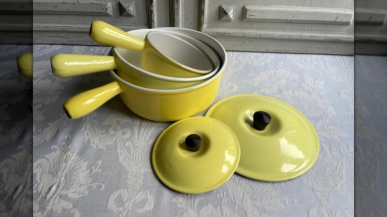 A set of nesting saucepans in Le Creuset's Elysee yellow