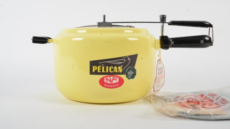 A bright yellow Le Creuset Pélican pressure cooker