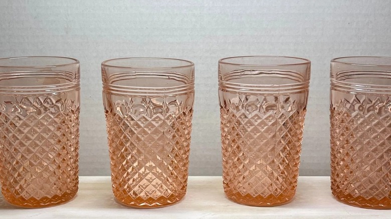 A set of four Hocking Glass Miss America tumblers on a shelf