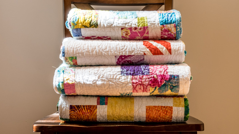 Stacked vintage quilts