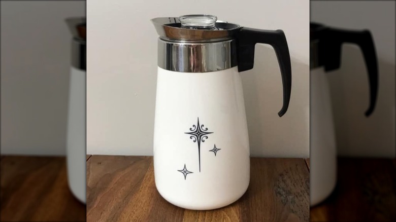 A Corningware percolator with the rare starburst pattern on an opaque background