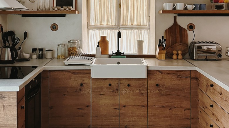 Modern rustic kitchen with wood cabinets.