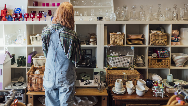 A person looks at decor at an antique store