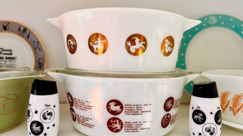 The Pyrex Nemacolin Country Club Promo casserole dish with other Zodiac patterned dishware.