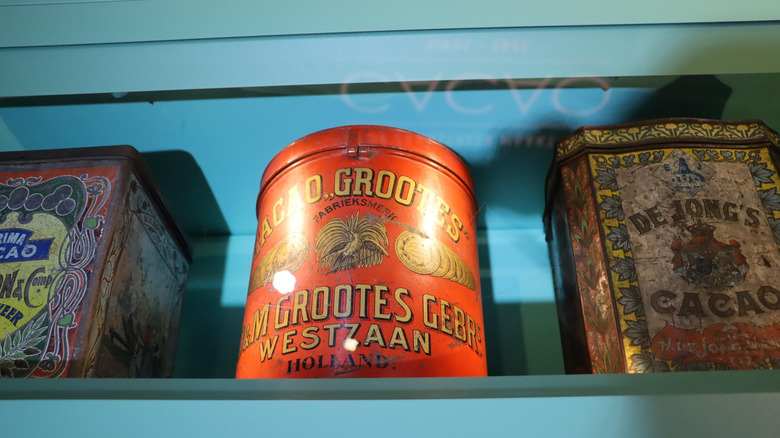 Three vintage cans on a shelf