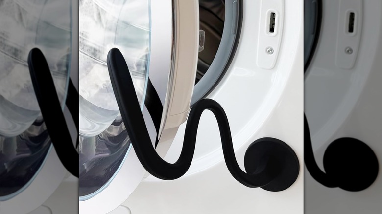 magnetic, bendable door prop keeping front-load washing machine door partially open for airing out