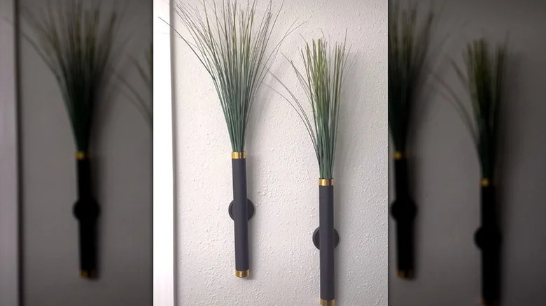 Paper towel rolls upcycled into pair of modern wall hangers for artificial decor