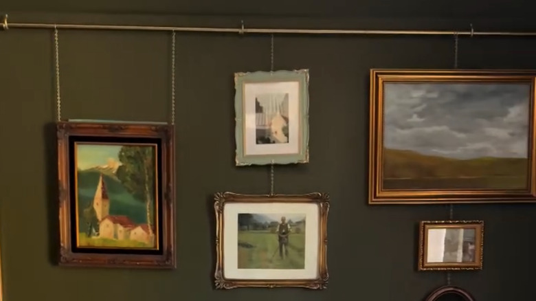 Curtain rod wall decor with vintage frames