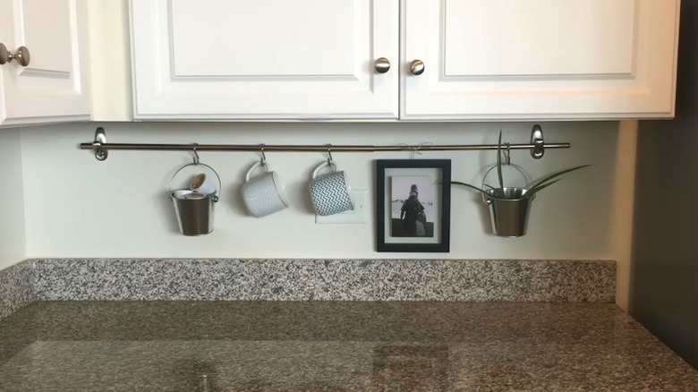 Curtain rod hack for keeping kitchen items organized