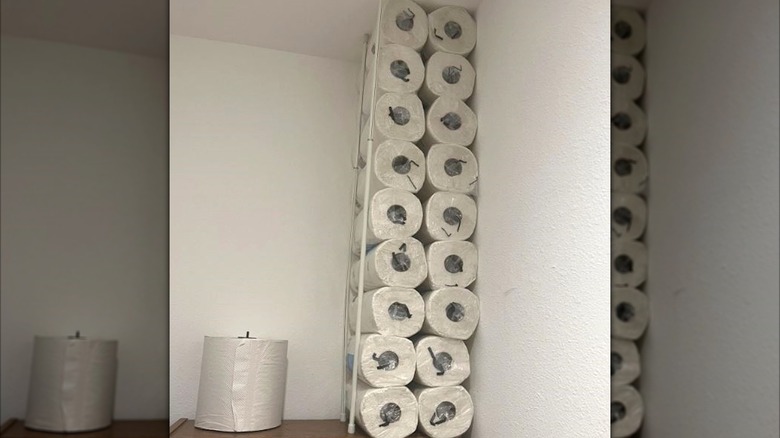 Stacked paper towel rolls using curtain rod hack