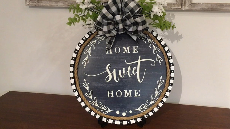 Farmhouse-style countertop decor piece made from a pizza pan