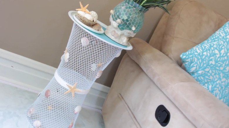 Side table made with wire trash bins and a pizza pan