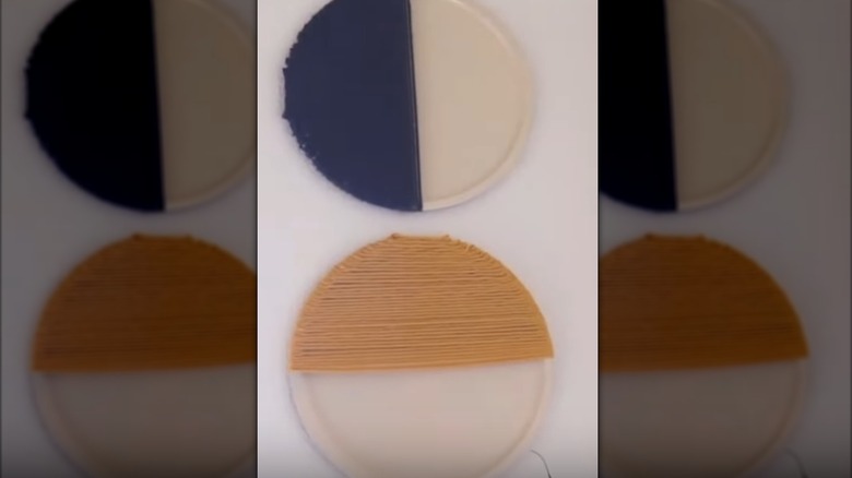 Modern pizza pan wall art with yarn covering half the pan