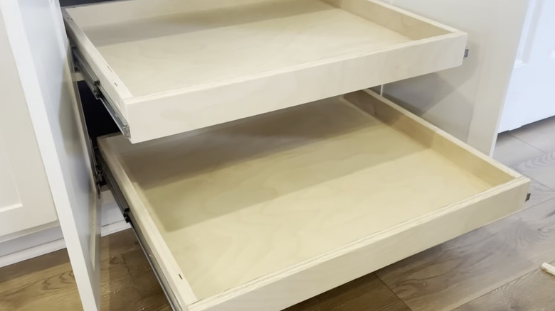 DIY pull-out shelves in a white kitchen
