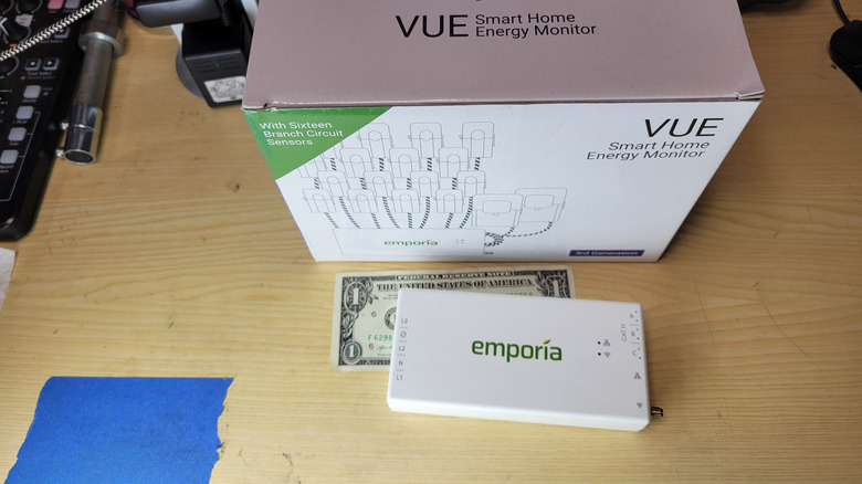 The Emporia Vue 3 power monitor compared to a dollar bill