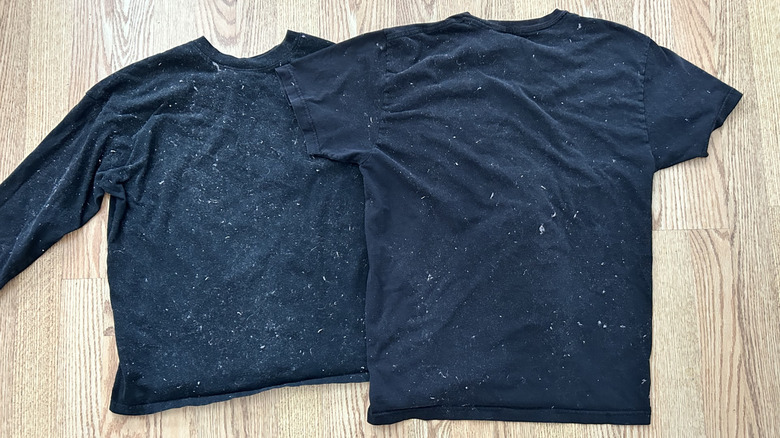 two black shirts covered with lint