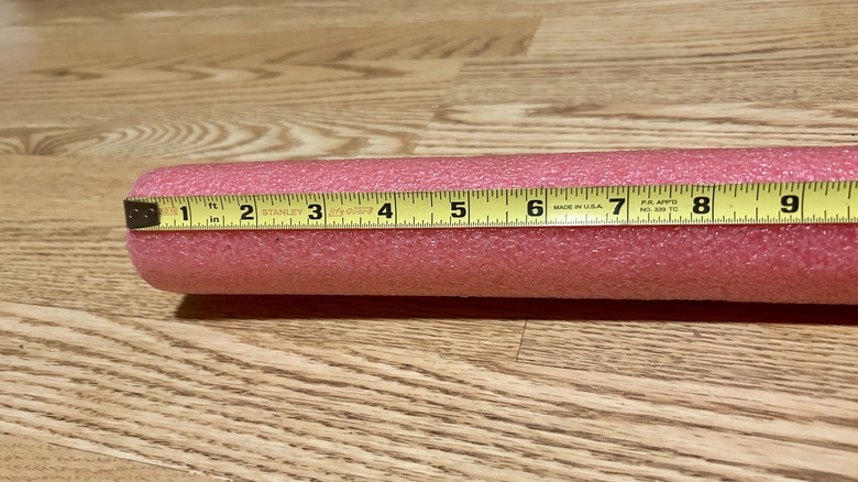 Measuring a pool noodle section to fit the door gap