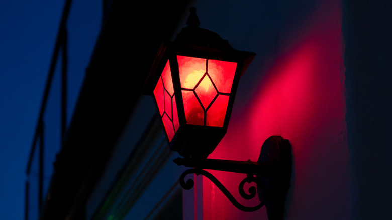 A red lantern on the side of a house