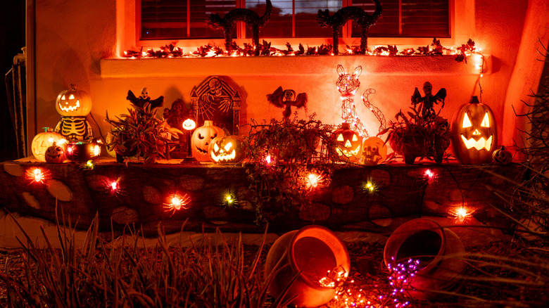 Glowing orange Halloween decorations outside a home