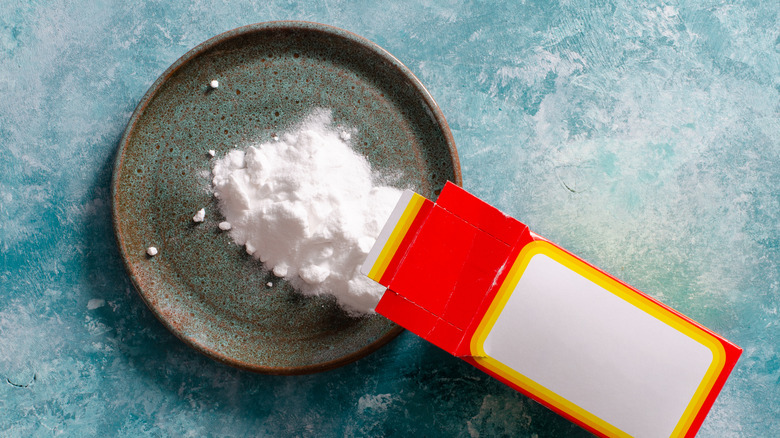 Baking soda being poured from a box