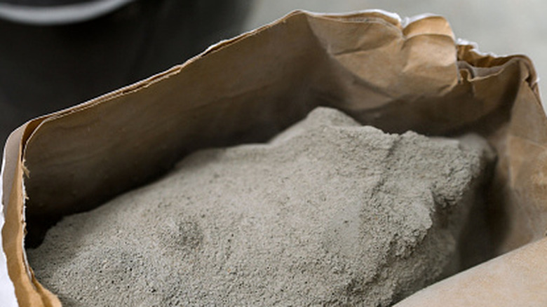 An open bag of dry concrete mixture