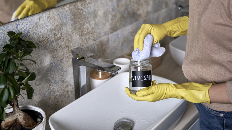 Woman cleaning with vinegar