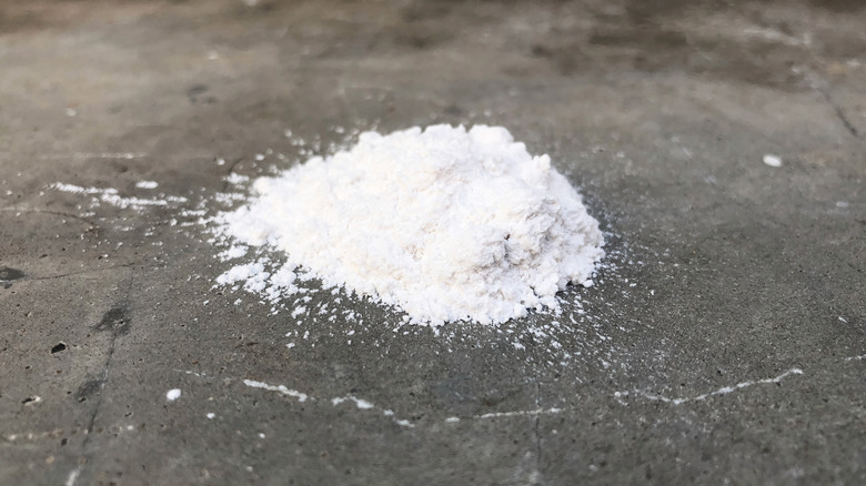 White baking soda on spill on concrete floor
