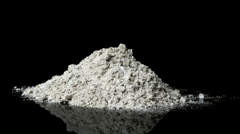 Pile of fly ash with black background