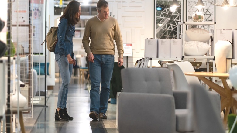Couple looking at products in IKEA furniture store