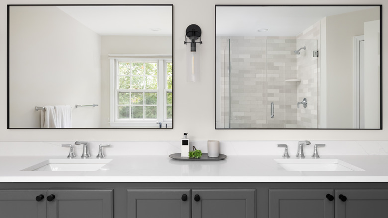 Long bathroom vanity with double sink and mirrors