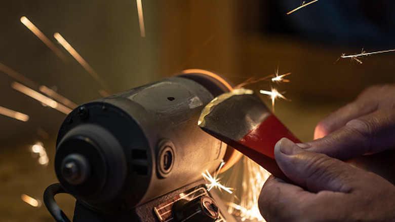 sparks flying on sharpened axer blade