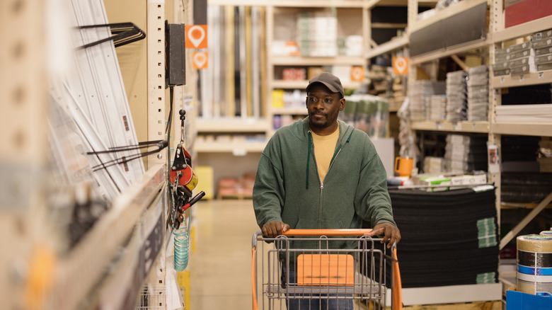 Man browsing in a home improvement store.