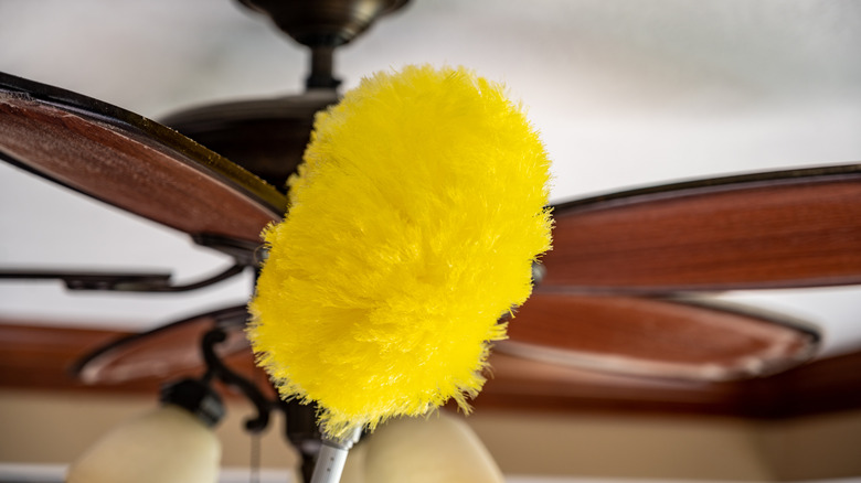 a yellow duster and ceiling fan