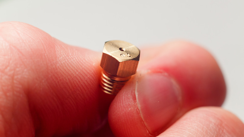 An orifice used to convert anatural gas stove to propane