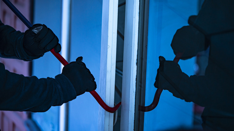 breaking into a home with a crowbar