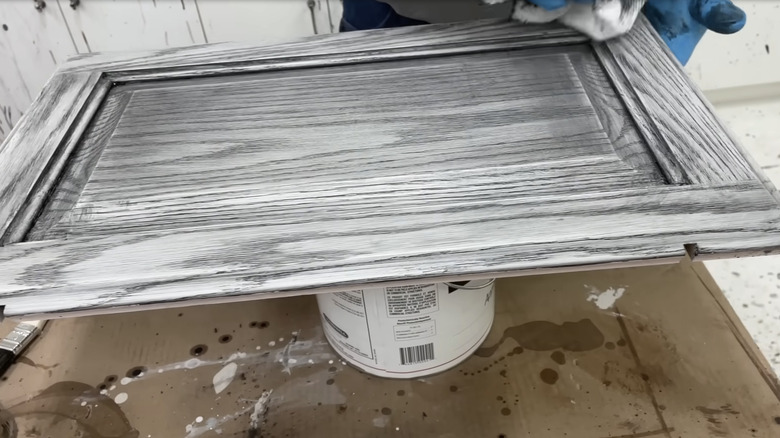 Cerused cabinet door with black and white layers