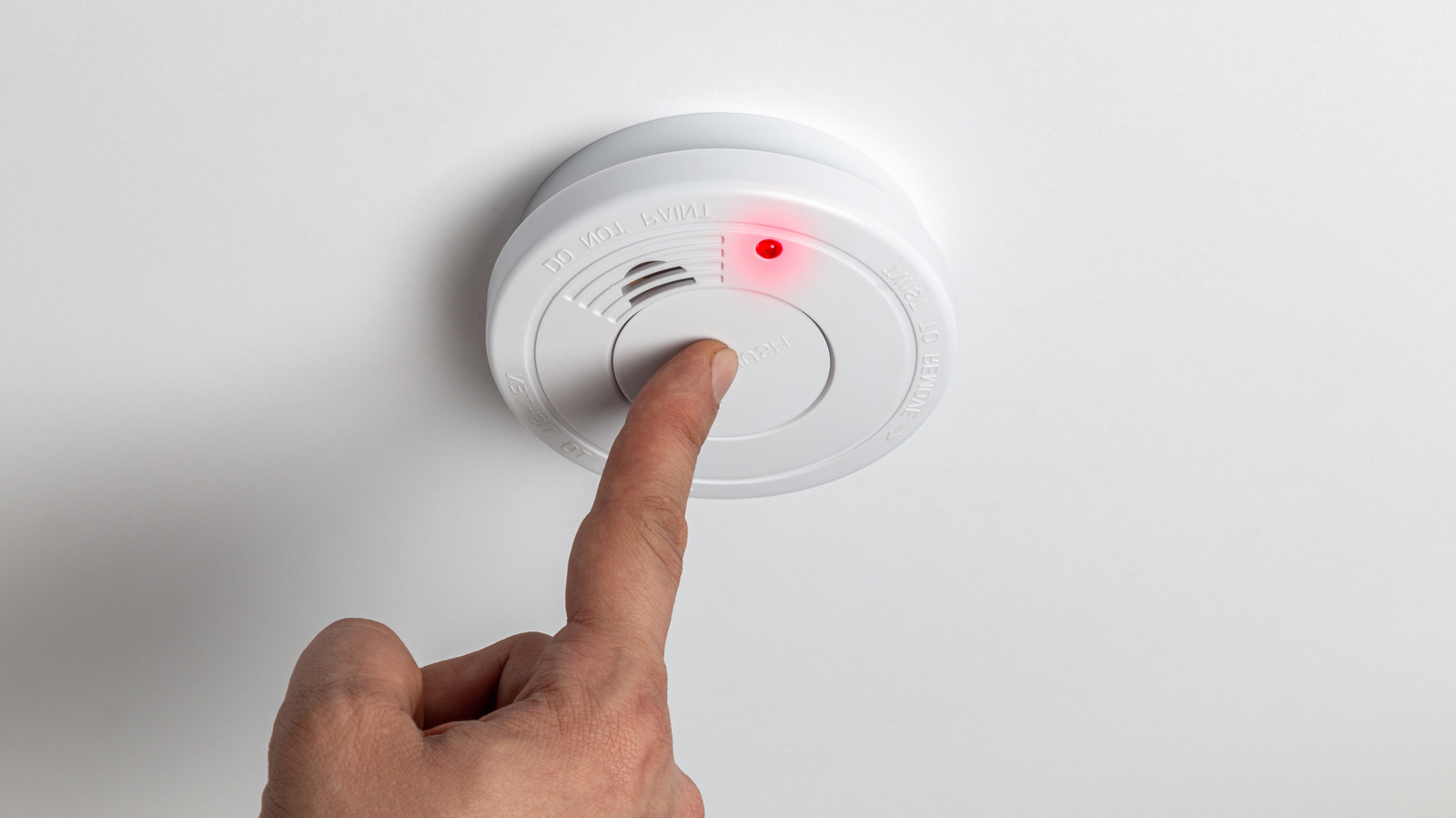 Why There's A Tiny Red Light Flashing On Your Smoke Detector