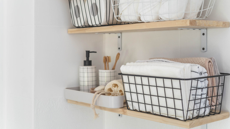 Hand towels kept in a basket in a bathroom